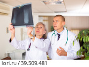 Two doctors analyzing roentgenogram. Стоковое фото, фотограф Яков Филимонов / Фотобанк Лори