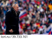 Выступление президента РФ Владимира Путина в рамках митинг-концерта "Слава защитникам Отечества", посвященного участникам спецоперации и празднованию Дня защитника Отечества на стадионе Лужники в городе Москве, Россия (2023 год). Редакционное фото, фотограф Андрей Дегтярёв / Фотобанк Лори