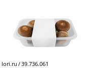 shiitake organic mushrooms for sale in a plastic tray on a light background. lentinula edible, Japanese forest mushroom. Стоковое фото, фотограф Оксана Медведева / Фотобанк Лори