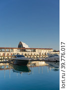 Sea port with yacht Parking on the background of the multimedia screen fanzone FIFA -2018. Редакционное фото, фотограф Виктория Кольцова / Фотобанк Лори