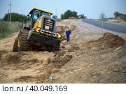 South Kazakhstan - April, 26 2012: Development of West Europe-West China road. Groundworks with bulldozer. Редакционное фото, фотограф Alexey Rezvykh / Фотобанк Лори