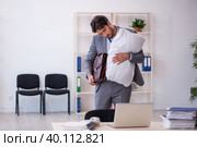 Young male employee in oversleeping concept. Стоковое фото, фотограф Elnur / Фотобанк Лори