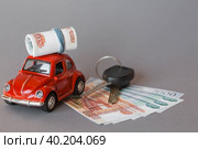 Автокредит. Покупка и аренда автомобиля. Красная машина, деньги и ключи от машины на сером фоне. Концепция покупки и страхования транспортного средства. Стоковое фото, фотограф Photojuli / Фотобанк Лори
