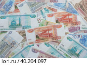 Российские деньги разных номиналов. Фон из денежных купюр. (2023 год). Стоковое фото, фотограф Photojuli / Фотобанк Лори