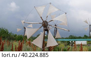 Whitewashed windmills on a meadow against a frowning sky. Crete, Greece (2023 год). Редакционное видео, видеограф Сергей Пристяжнюк (Serg Zastavkin) / Фотобанк Лори