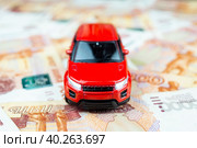 Toy car on money. Стоковое фото, фотограф Корнеев Вячеслав / Фотобанк Лори