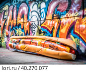 A big juicy hot dog in the style of graffiti. Стоковое AI-изображение, AI-художник Ярославский Максим / Фотобанк Лори