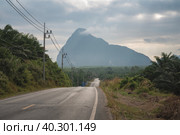 Beautiful road to the mountains at dawn. The route to the Samet Nangshe observation deck in Thailand. Travel and tourism (2023 год). Стоковое фото, фотограф Владимир Разгуляев / Фотобанк Лори