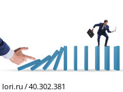 Businessman in domino effect concept. Стоковое фото, фотограф Elnur / Фотобанк Лори