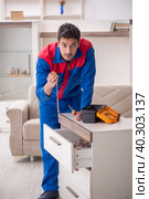 Young male carpenter stealing jewelry at home. Стоковое фото, фотограф Elnur / Фотобанк Лори