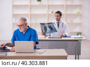 Two male doctors radiologists working in the clinic. Стоковое фото, фотограф Elnur / Фотобанк Лори