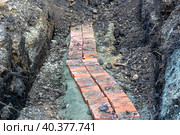 An underground electrical cable was opened to eliminate a cable break and again prepared for backfilling. Стоковое фото, фотограф Дмитрий Коростылев / Фотобанк Лори