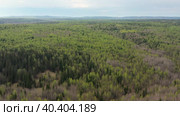 Южный Урал весной, вид на горную тайгу с воздуха. Southern Urals in spring, a view of the mountain taiga from the air. Стоковое видео, видеограф Евгений Романов / Фотобанк Лори