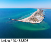 Aerial drone view of a tropical sandy beach dividing an exotic turquoise sea and lake. sand bar in the sea from above, flight over sand bar and colorful sea. Стоковое фото, фотограф Олег Спиридонов / Фотобанк Лори