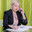 A woman director working in an office is sitting at a table, talking on the phone, checking documents. Стоковое фото, фотограф Юрий Поздников / Фотобанк Лори