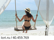 Young woman rides on a swing at Doc Let beach of Vietnam (2022 год). Стоковое фото, фотограф Татьяна Терехина / Фотобанк Лори
