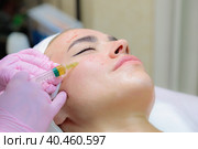 The doctor gives injections of blood plasma into the face of a young girl. Стоковое фото, фотограф Юрий Поздников / Фотобанк Лори