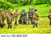Soldiers in military uniform of the second world war at the historical reconstruction to the Day of the Border Guard. Стоковое фото, фотограф Анна Кривицкая / Фотобанк Лори