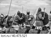 Russia, Staraya Ladoga 23,06,2012 Reenactors with shields and spears during the battle, the festival of historical reconstruction "Pages of History" Стоковое фото, фотограф Анна Кривицкая / Фотобанк Лори