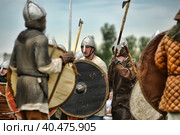 Russia, Staraya Ladoga 23,06,2012 Reenactors with shields and spears during the battle, the festival of historical reconstruction "Pages of History" Редакционное фото, фотограф Анна Кривицкая / Фотобанк Лори