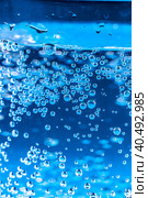 Close up of a sparkling water bottle with condensation on it. Стоковое фото, фотограф Сергей Толмачёв / Фотобанк Лори
