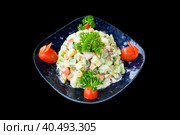 Russian salad olivie on black background top view. Стоковое фото, фотограф Татьяна Терехина / Фотобанк Лори