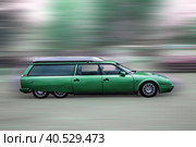 Green vintage six-wheeled car, blurred background. Стоковое фото, фотограф Iva Noel / Фотобанк Лори