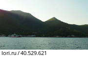 Boka Kotor Adriatic Sea, Verige Strait Lepetane Ferry Line Trajekt. People, cars and houses on the shore in the evening. Tourism and business in Montenegro. Maritime transport ferryboat August 18 2022. Стоковое видео, видеограф Юлия Петровская / Фотобанк Лори