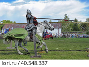 Two knights fight on spears at the festival of historical reconstruction "Russian Fortress" (2014 год). Редакционное фото, фотограф Анна Кривицкая / Фотобанк Лори