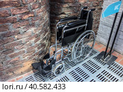 Folded wheelchair. Public toilet. Стоковое фото, фотограф Iva Noel / Фотобанк Лори