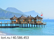 Kemer, Turkey - 06. 21.2014. Pier with gazebos for relaxation. Редакционное фото, фотограф Володина Ольга / Фотобанк Лори