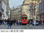 Nostalgic Red Tram of Istanbul. Historic tram in Taksim Istiklal Street. Touristic popular destination Taksim Istiklal Street. (2018 год). Редакционное фото, фотограф Анна Кривицкая / Фотобанк Лори