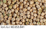 Dry yellow seeds of green peas slowly descend. Natural grain fund. Textured Pea Grains close-up. Organic Protein Food. Стоковое видео, видеограф Александр Кротков / Фотобанк Лори