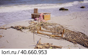 Furniture and other drifting debris has reached Black Sea beaches in Odessa, Ukraine. Environmental disaster caused by explosion of Kakhovka Hydroelectric Power Plant dam. Стоковое фото, фотограф Некрасов Андрей / Фотобанк Лори
