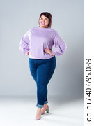 Plus size fashion model in casual clothes, fat woman on gray background. Стоковое фото, фотограф Станислав Тарко / Фотобанк Лори