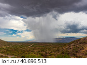 Thunderhead cloud produces rain shower over semi-desert grassland prairie. Стоковое фото, фотограф Анна Кривицкая / Фотобанк Лори