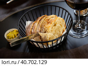 Sliced artisanal white bread with spicy herb butter. Стоковое фото, фотограф Яков Филимонов / Фотобанк Лори