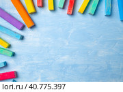 Colorful chalks on blue background with copy space for text. Стоковое фото, фотограф Сергей Толмачёв / Фотобанк Лори