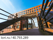 Famous landmark old Speicherstadt in Hamburg, build with red bricks. Bridge in low angle view. Стоковое фото, фотограф Igor Tichonow / Фотобанк Лори