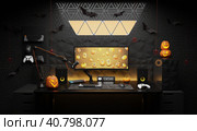 A general view of a gamer's home workplace with a computer and a gamepad decorated with decorations for the Halloween holiday. Стоковая иллюстрация, иллюстратор Енваев Андрей / Фотобанк Лори