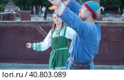 Dance of firemen reenactors with chains in medieval clothes (2022 год). Редакционное видео, видеограф Потийко Сергей / Фотобанк Лори