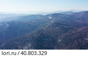 Горный Алтай зимой: хребет Иолго. Вид с воздуха. Altai mountains in winter: Iolgo Ridge. Aerial view. Стоковое видео, видеограф Евгений Романов / Фотобанк Лори