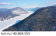 Горный Алтай зимой: Телецкое озеро. Вид с воздуха. Altai mountains in winter: Teletskoye lake. Aerial view. Стоковое видео, видеограф Евгений Романов / Фотобанк Лори