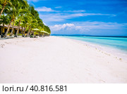 Tropical sandy beach at Panglao Bohol island with Sme Beach chairs under palm trees. Travel Vacation. Philippines (2014 год). Стоковое фото, фотограф Igor Tichonow / Фотобанк Лори