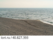 Photography of different blue colors of  surf of Baltic sea. Restless sea before storm. Waves going onto sandy beach. View from above. Concept of the strength in nature. Стоковое фото, фотограф YuryKara / Фотобанк Лори