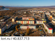 Aerial view of the northern urban-type settlement of Ola. Top view of painted multi-colored buildings. Ola is the administrative center of the Olsky district of the Magadan region. Siberia, Russia. Стоковое фото, фотограф Андрей Степанов / Фотобанк Лори