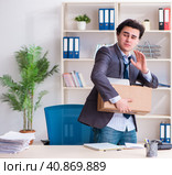 Young male employee being fired from his work. Стоковое фото, фотограф Elnur / Фотобанк Лори