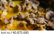 Close-up of Chicken Gizzard stewing with vegetables in a wok. Asian-style cooking. Стоковое фото, фотограф Воловодов Владимир / Фотобанк Лори