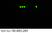Wi-Fi router or modem light blinking. Wireless internet connection. Flashing green warning lights in black darkness. The process of transferring information through modern means of communication. Стоковое видео, видеограф Юлия Петровская / Фотобанк Лори