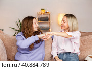 Young mother chatting with teen daughter together at home. Стоковое фото, фотограф Гладских Татьяна / Фотобанк Лори